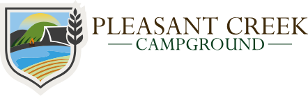 Logo: Wolf standing in a park, text 