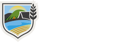 Logo: Wolf standing in a park, text 