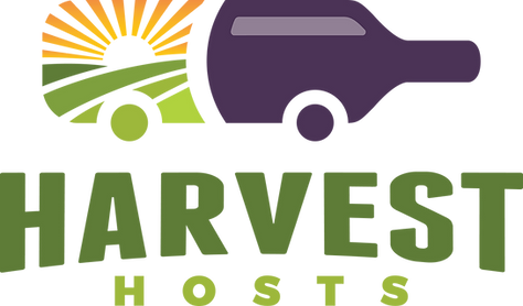 Logo for Harvest Hosts featuring a stylized purple motorhome shape with a sunrise and green field, text reads Harvest Hosts.
