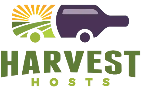 Harvest Hosts logo with green and purple truck and field graphic