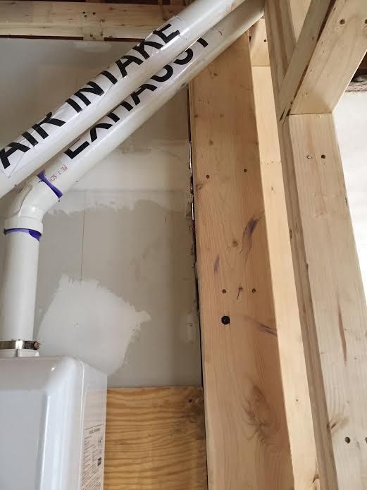 White PVC pipes labeled 