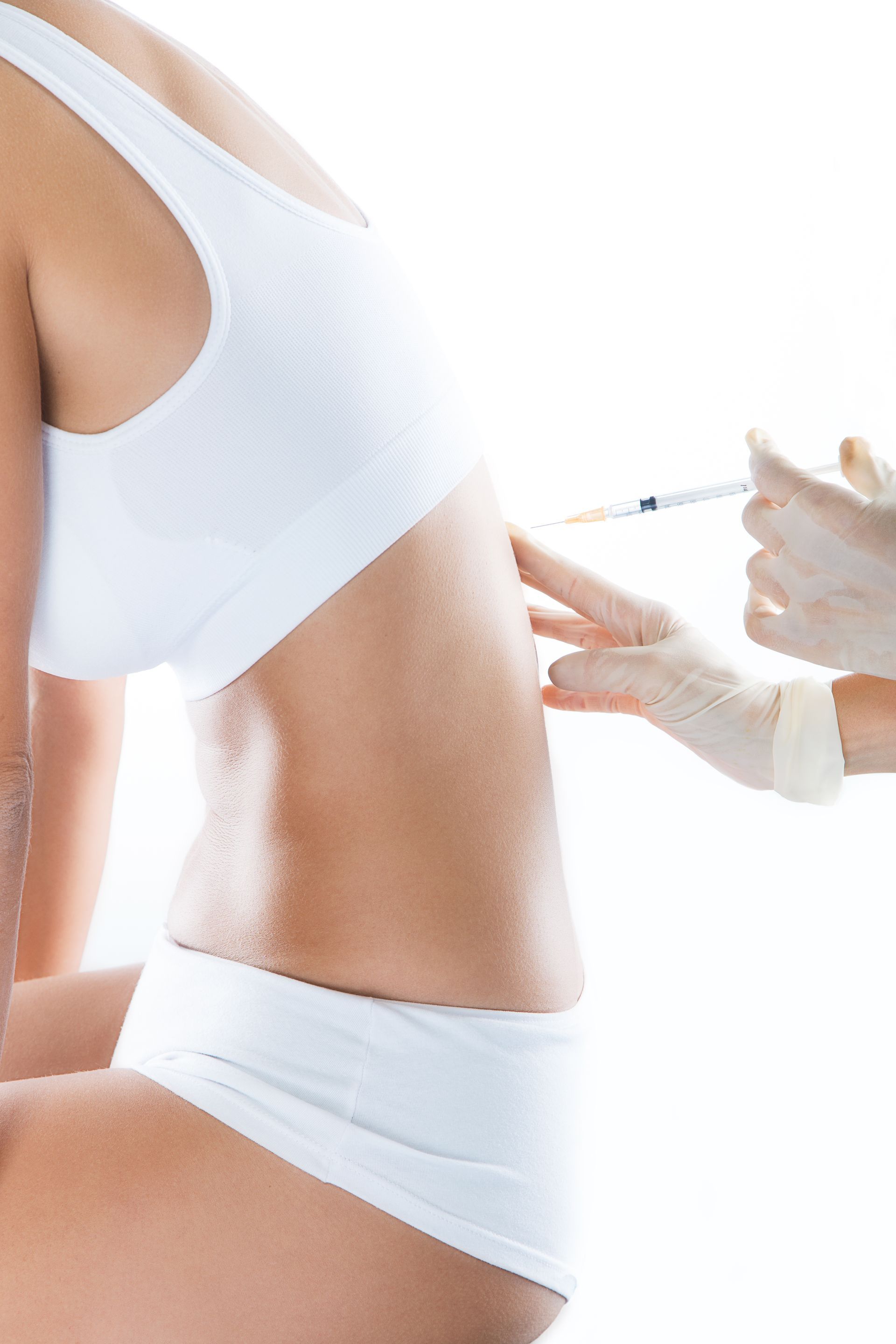 A woman is getting an injection in her back.