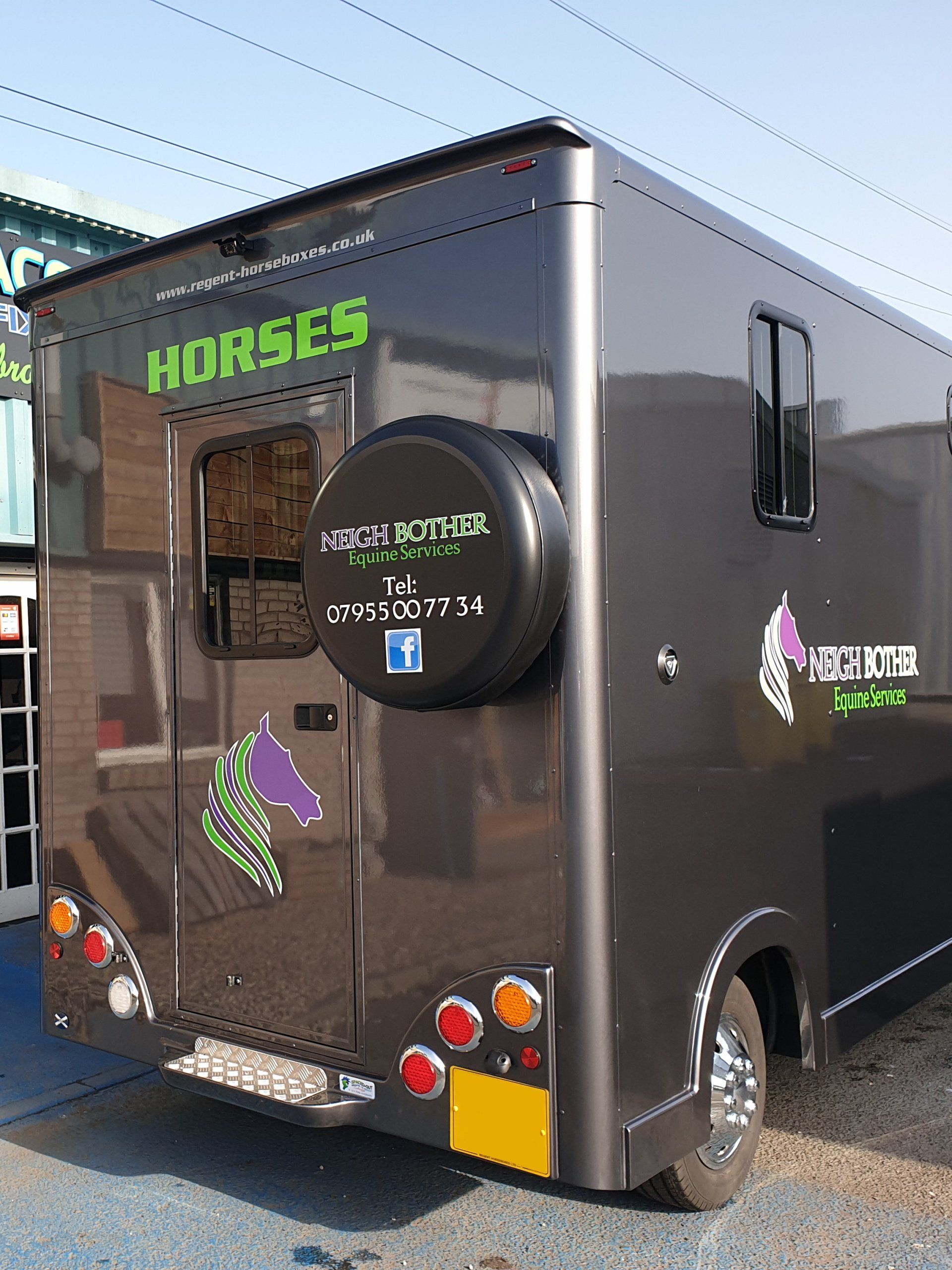 Car signs on a horse trailer, rear view