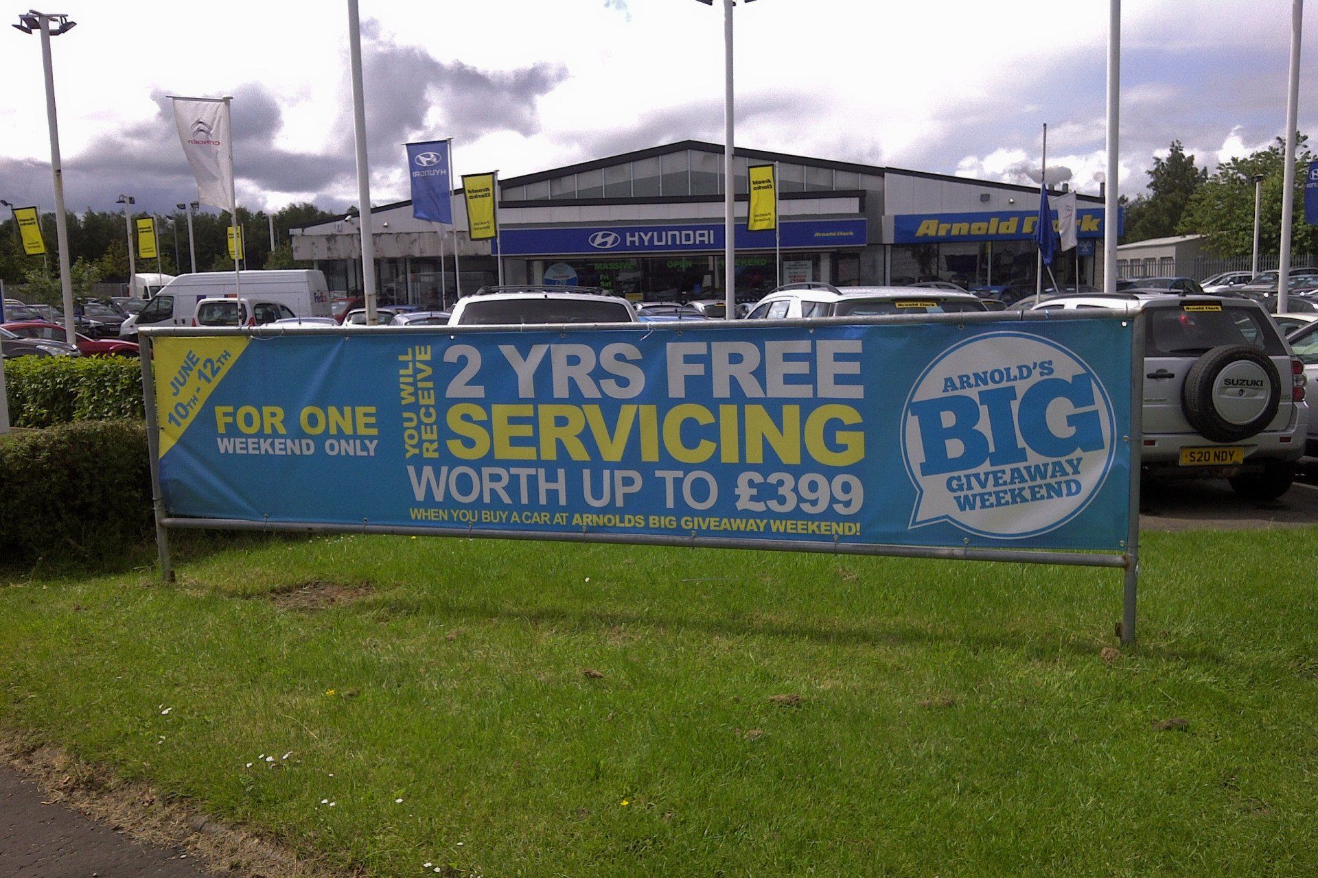 Outdoor large scale street sign at a car dealership