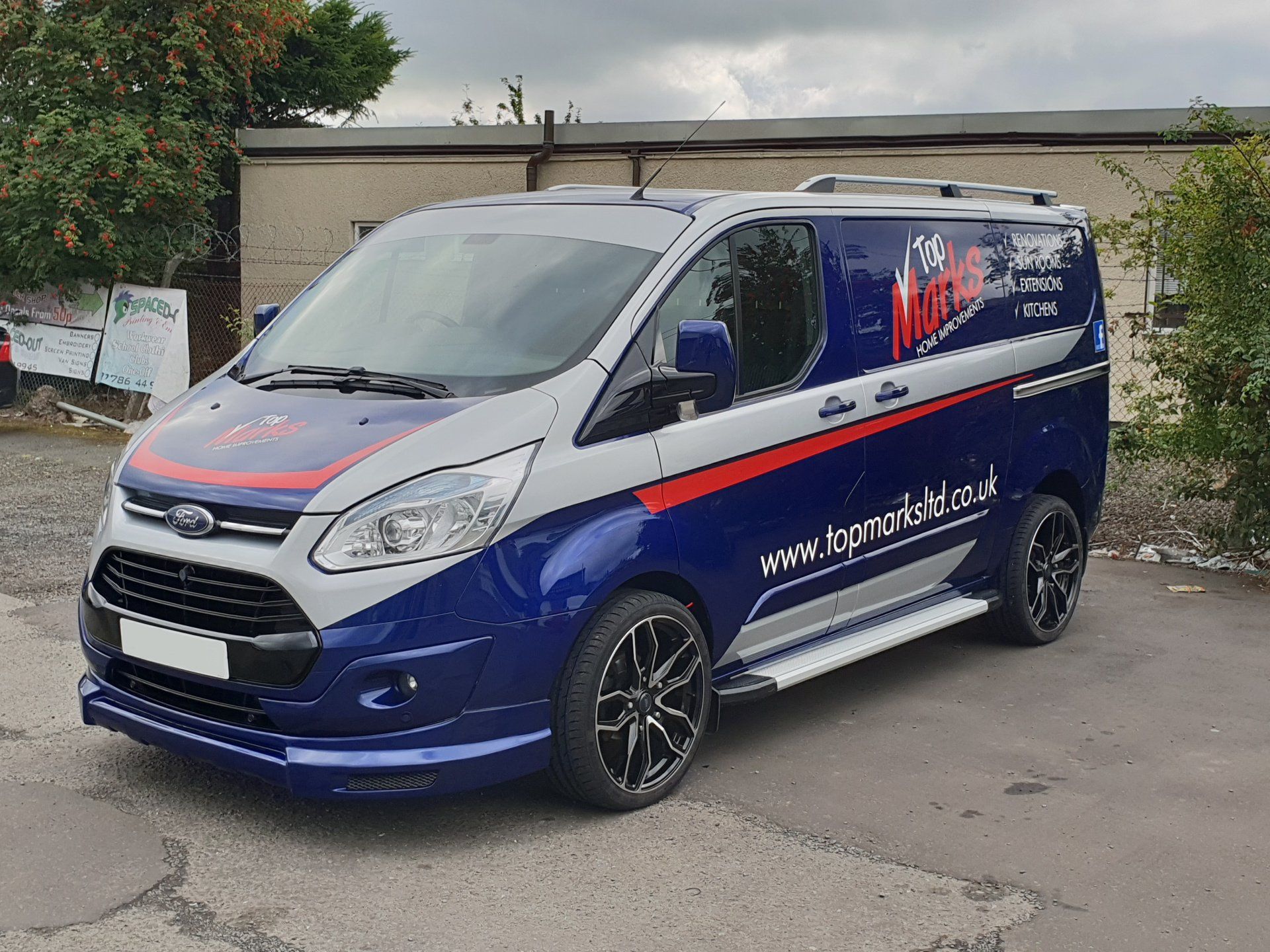 Car decals on Ford Transit Custom van in blue