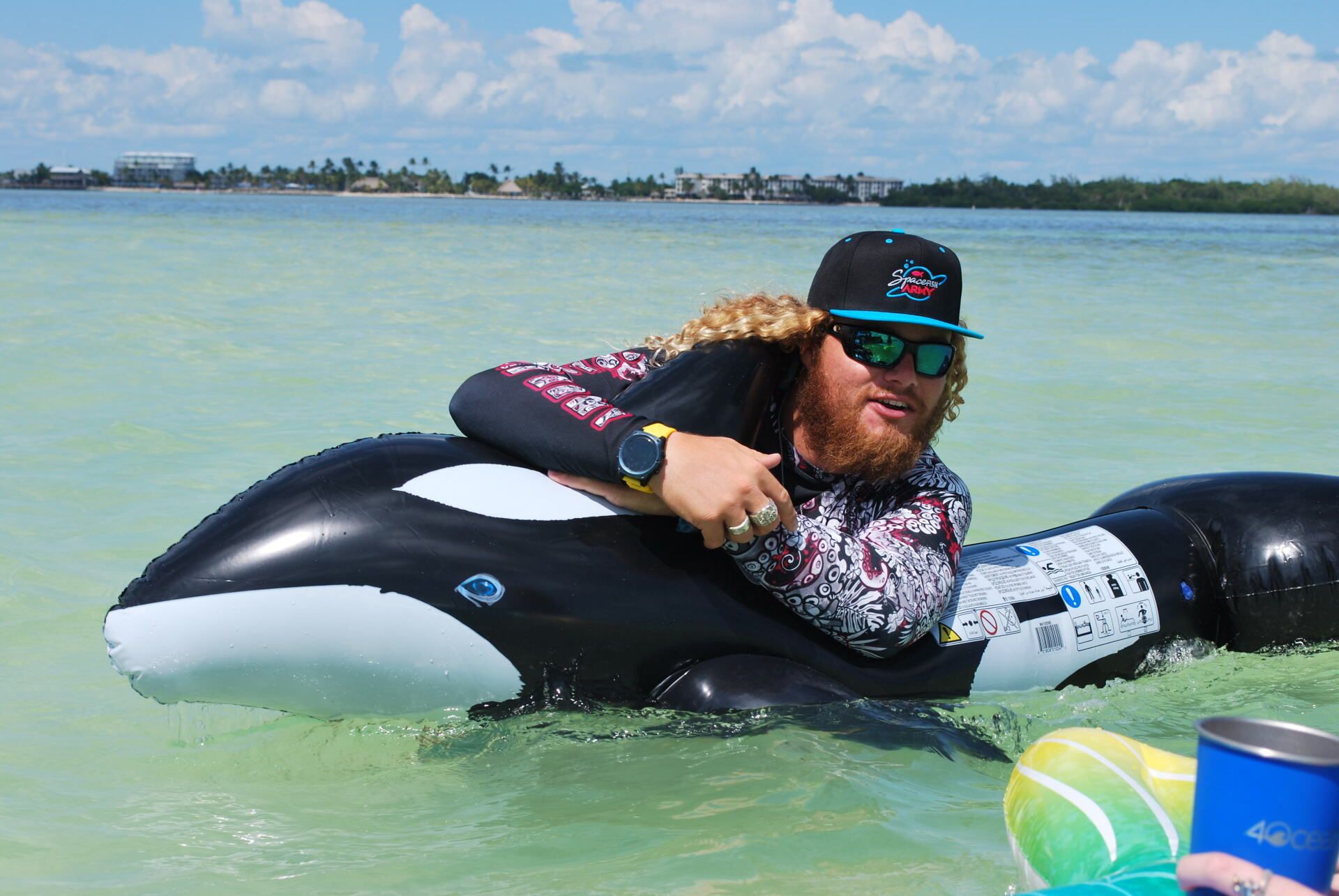 Man riding an Orca floater