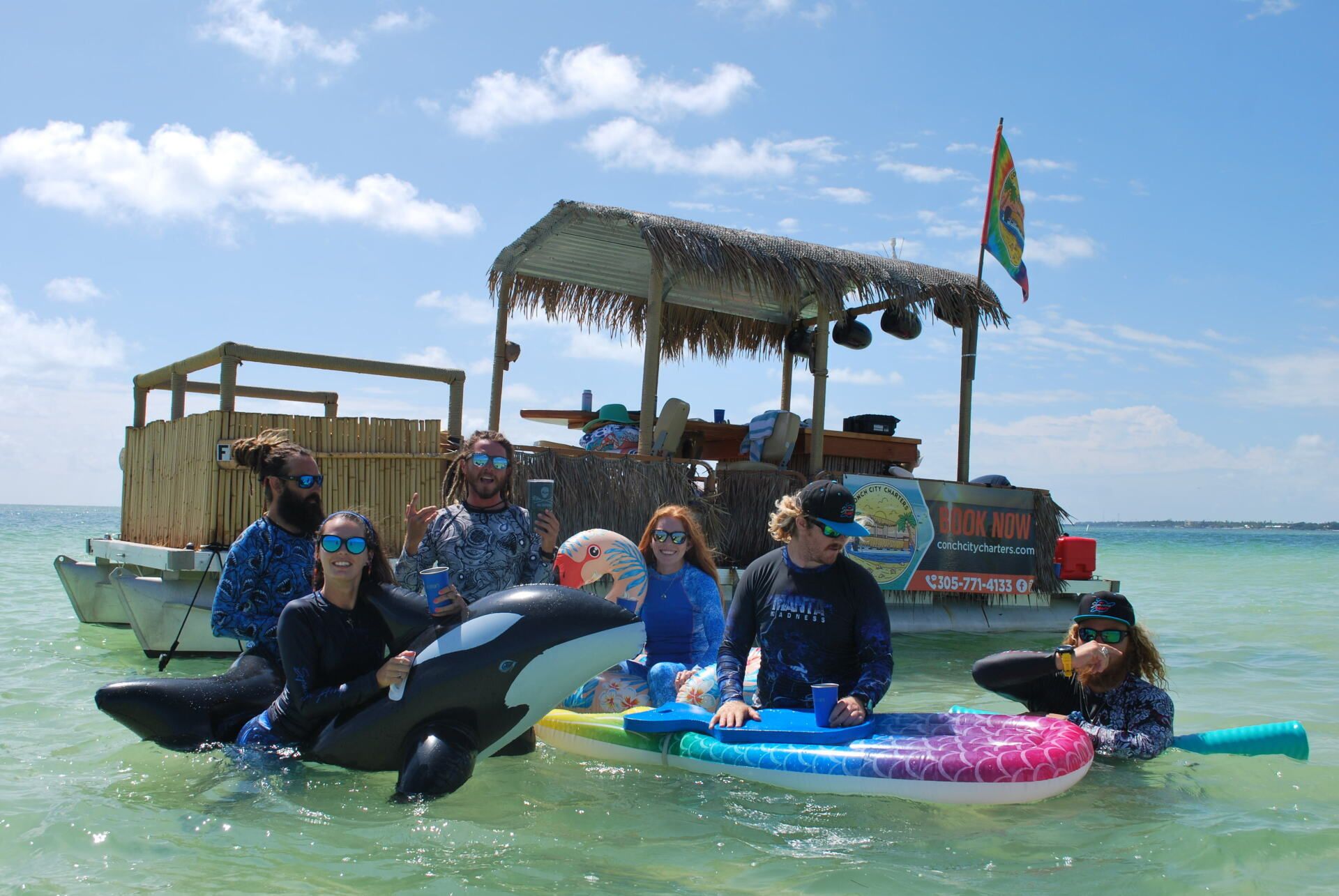Group of people swimming with their floaters on