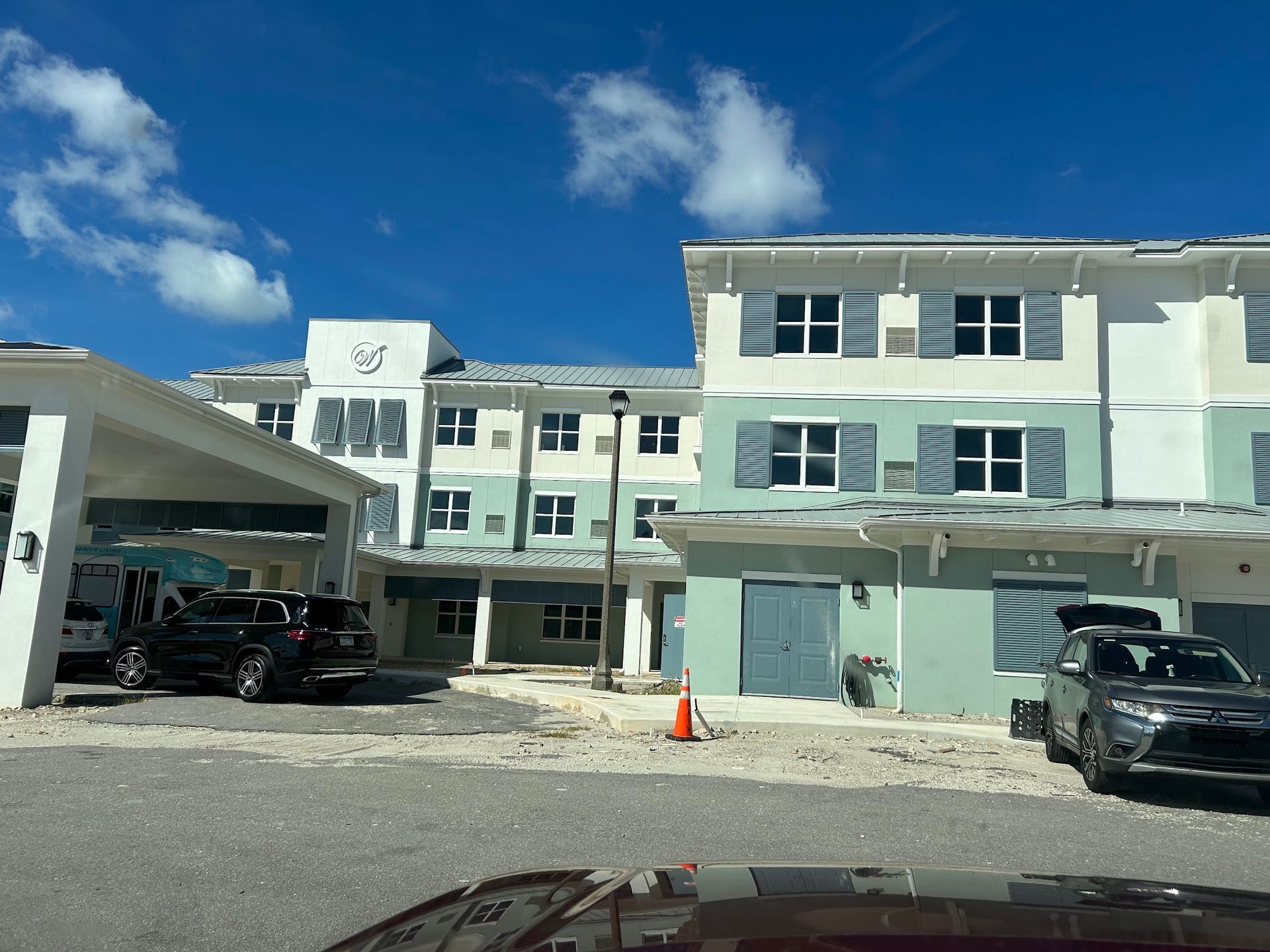 A large building with cars parked in front of it