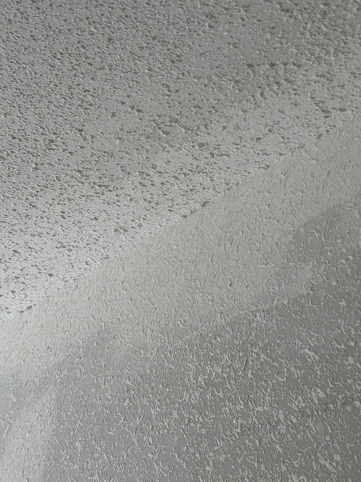 A close up of a metal surface with a lot of small dots on it.