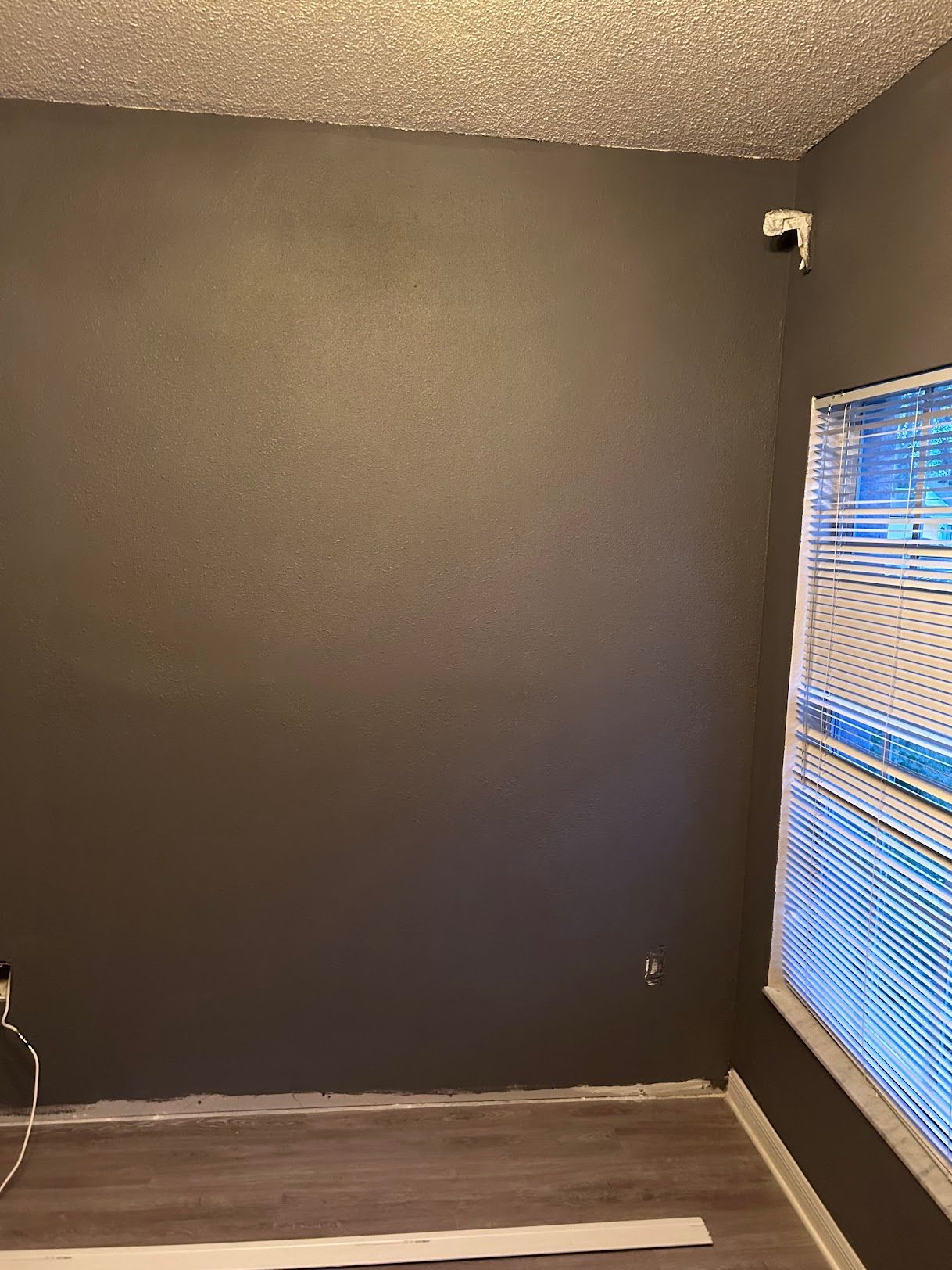 There is a window in the corner of the room.