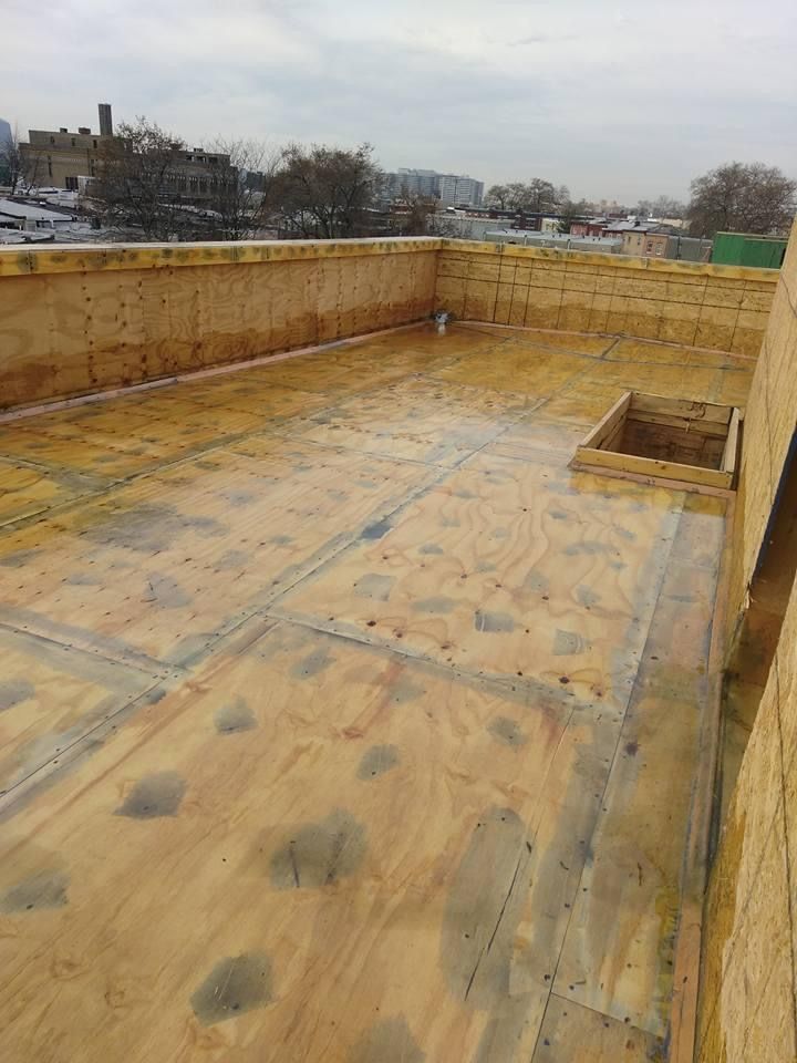 A wooden roof with a hole in the middle of it.