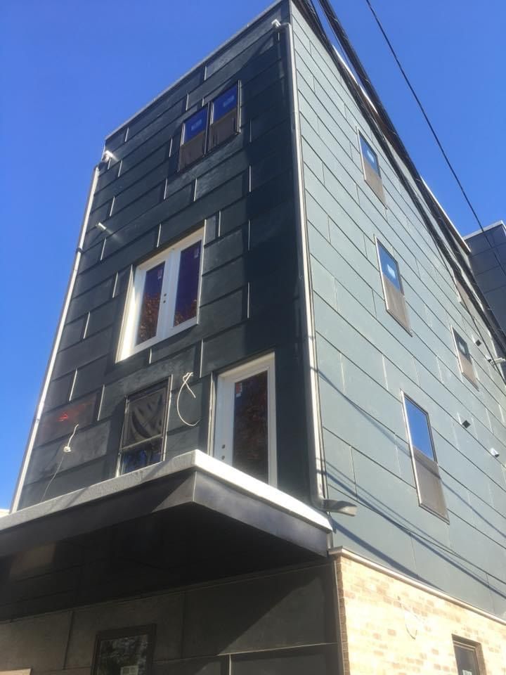 A tall building with a blue sky in the background