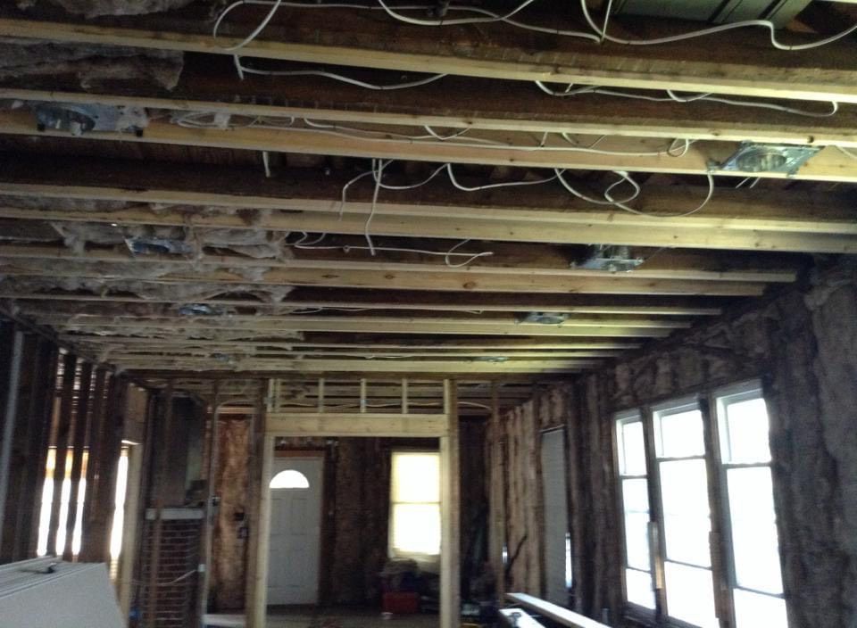 A room with a lot of wires hanging from the ceiling