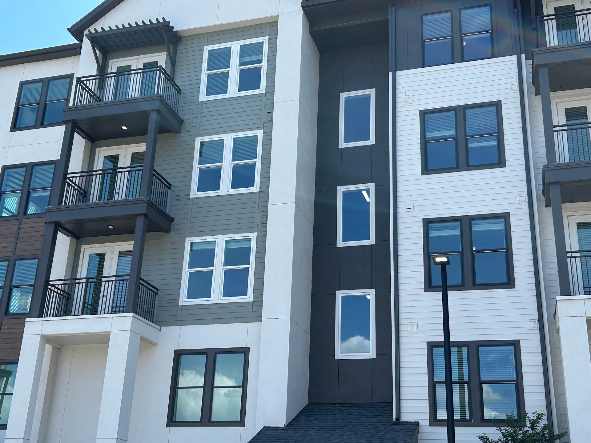 A large apartment building with a lot of windows and balconies