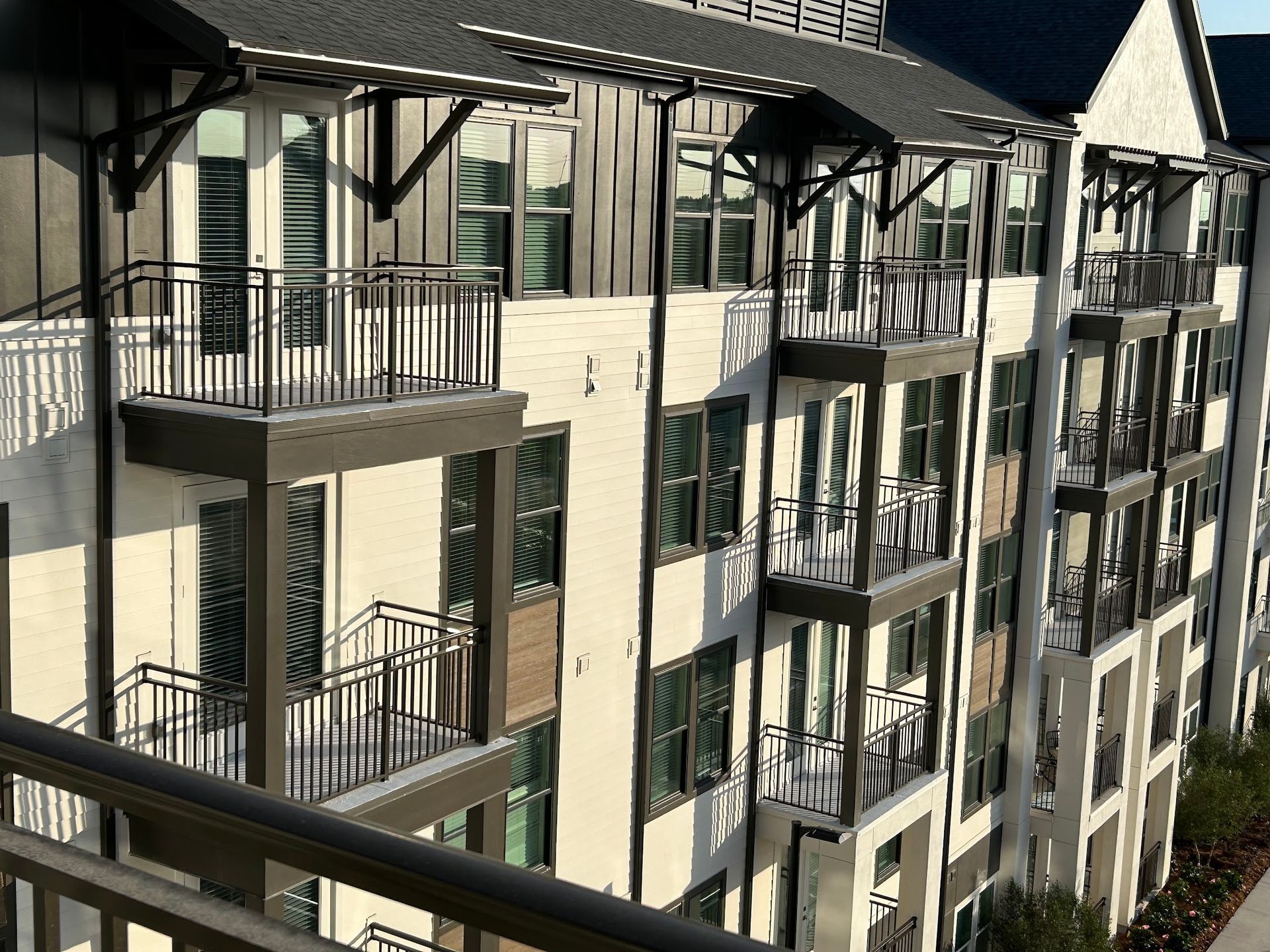 A large apartment building with lots of balconies and windows