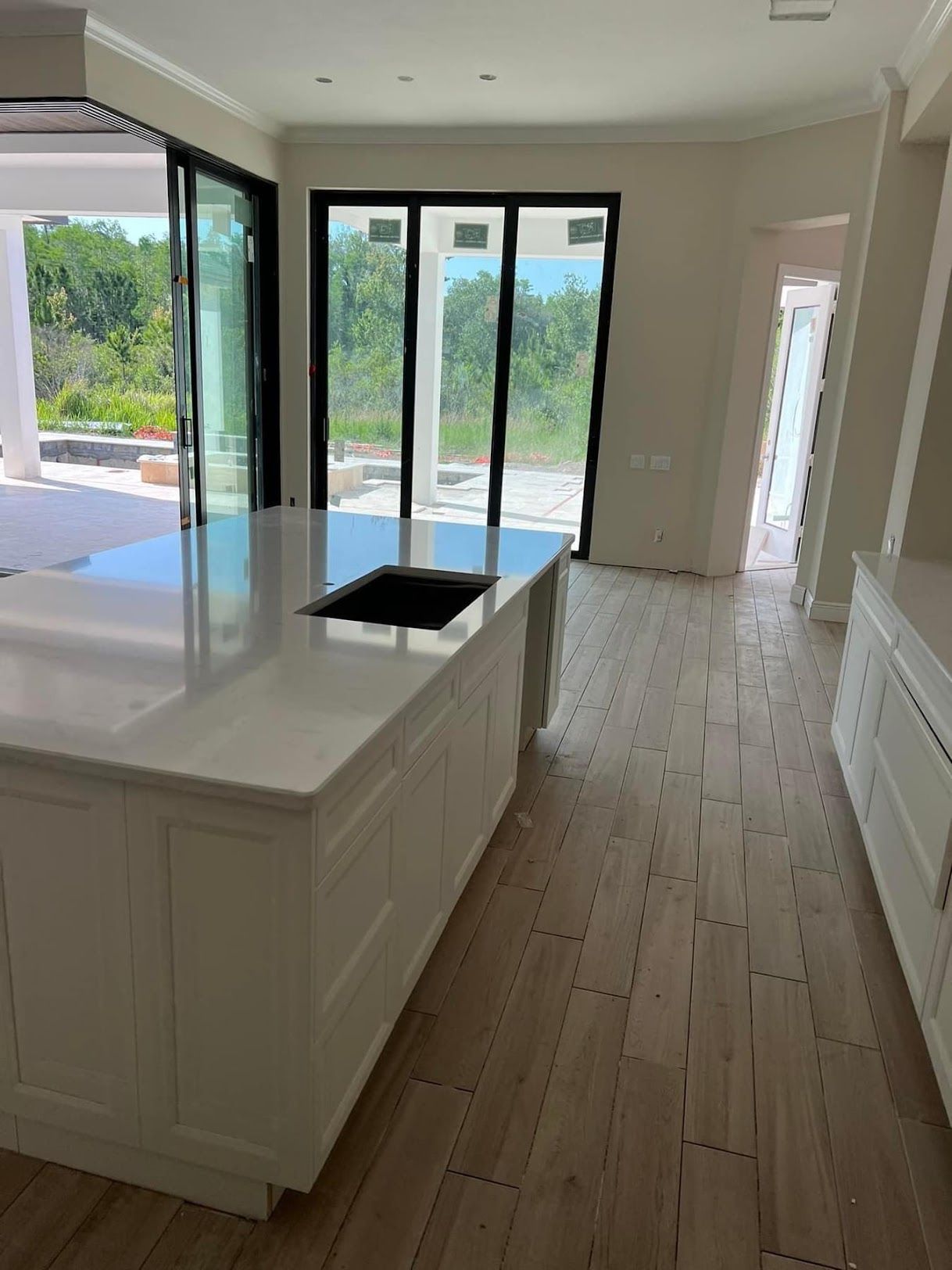 A kitchen with a large island and a sink