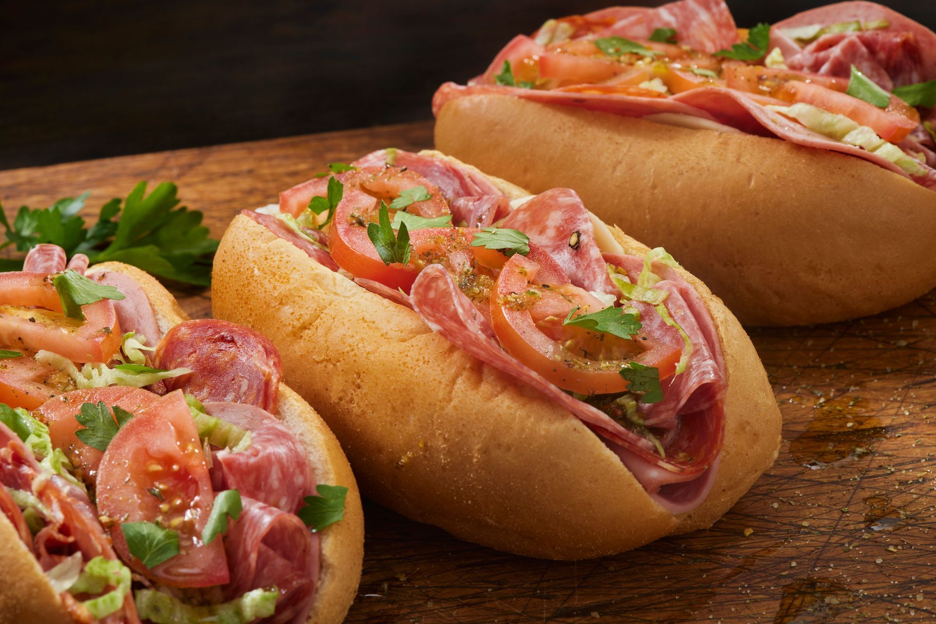 A close up of a piece of salmon on a plate with vegetables.