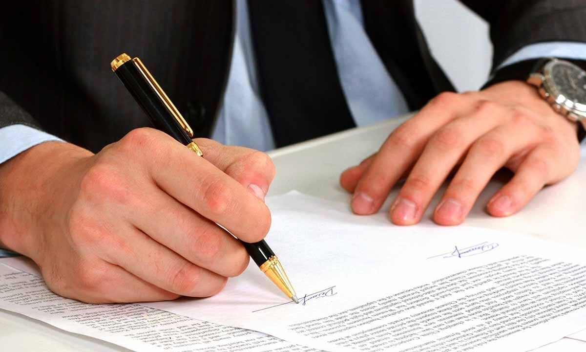 Businessman signing terms and conditions