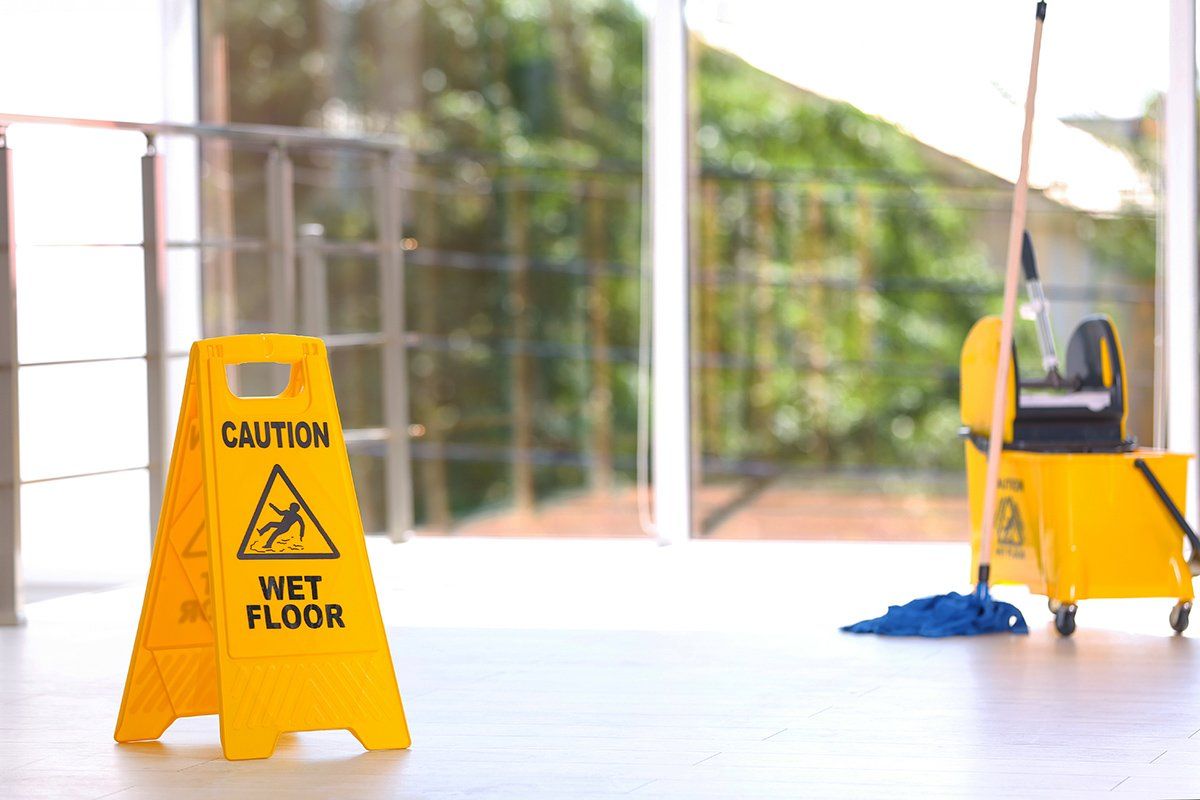 Cleaners wet floor sign with mop and bucket