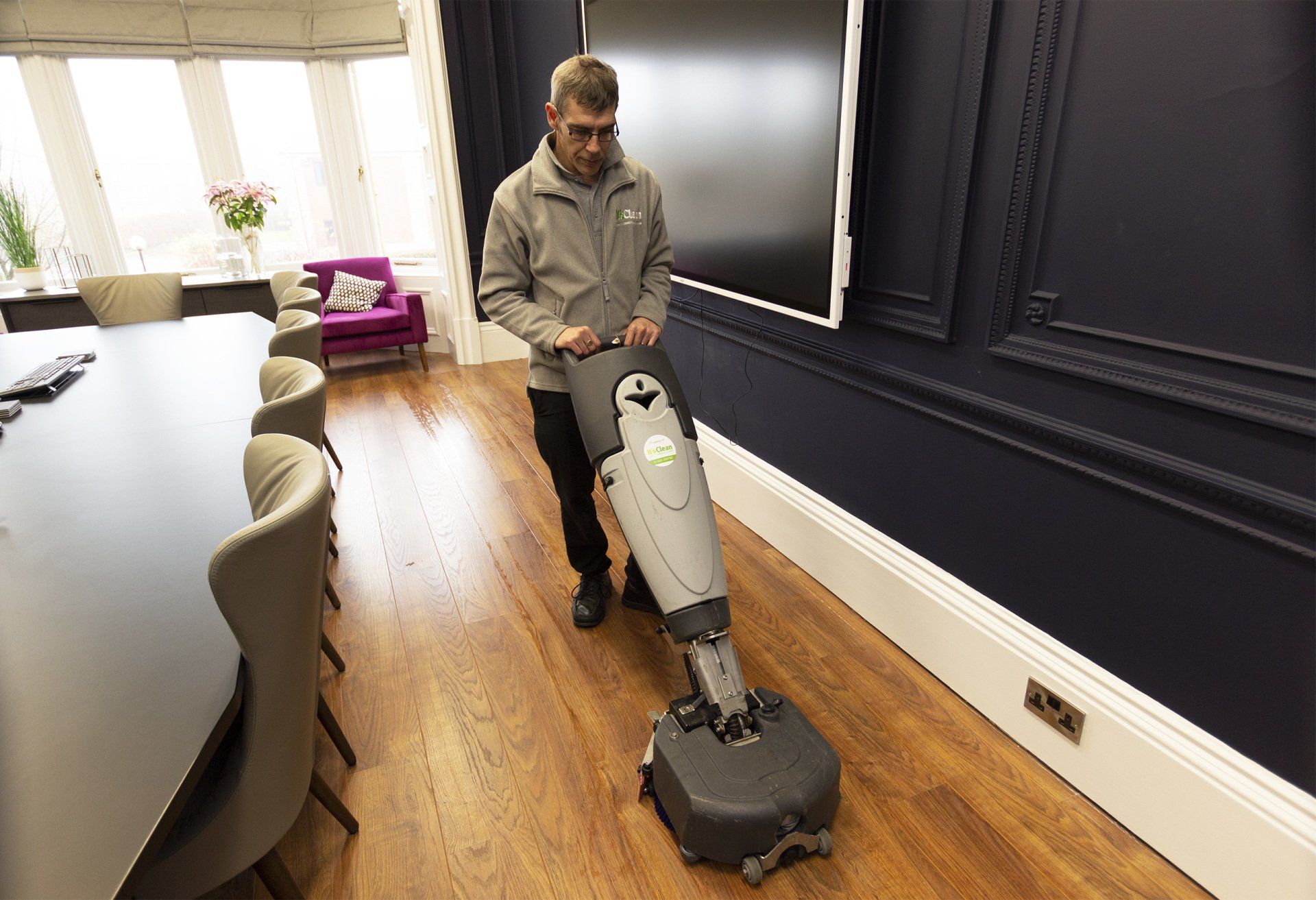 Floor scrubber cleaning office conference room in Harrogate