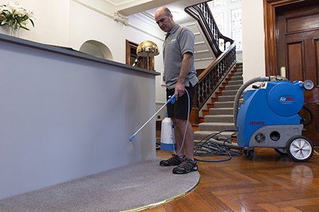 Pre-spray of office carpet prior to cleaning