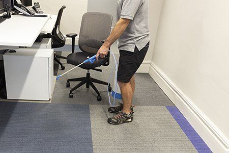 Pre-spray of office carpet tiles with Dry Fusion activator solution