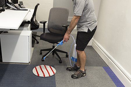 Pre-spray of cleaning pad with Dry Fusion activator solution in office