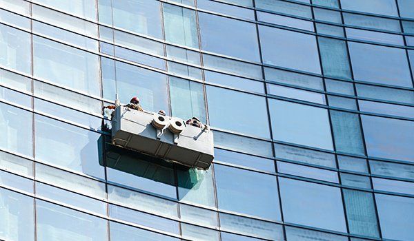 Office window cleaning from a cradle
