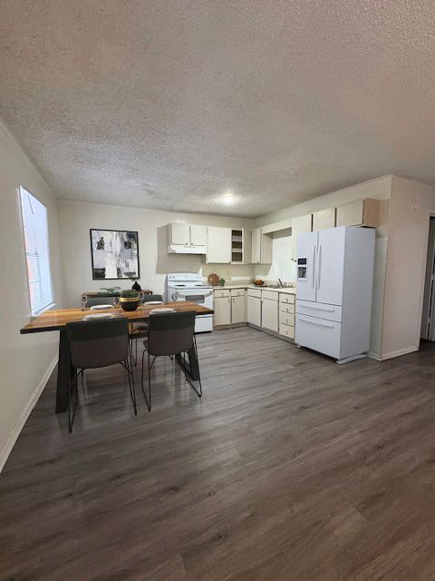 Photo of a kitchen with a small dining area