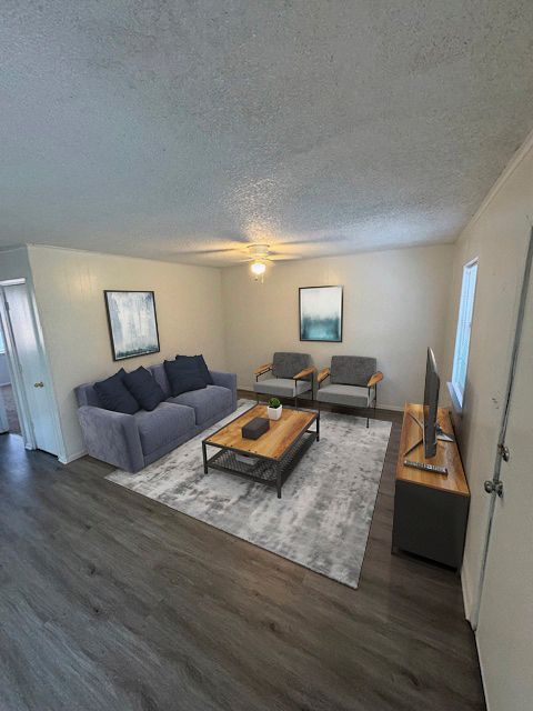 Photo of a living room with 3 surrounding walls enclosing the space