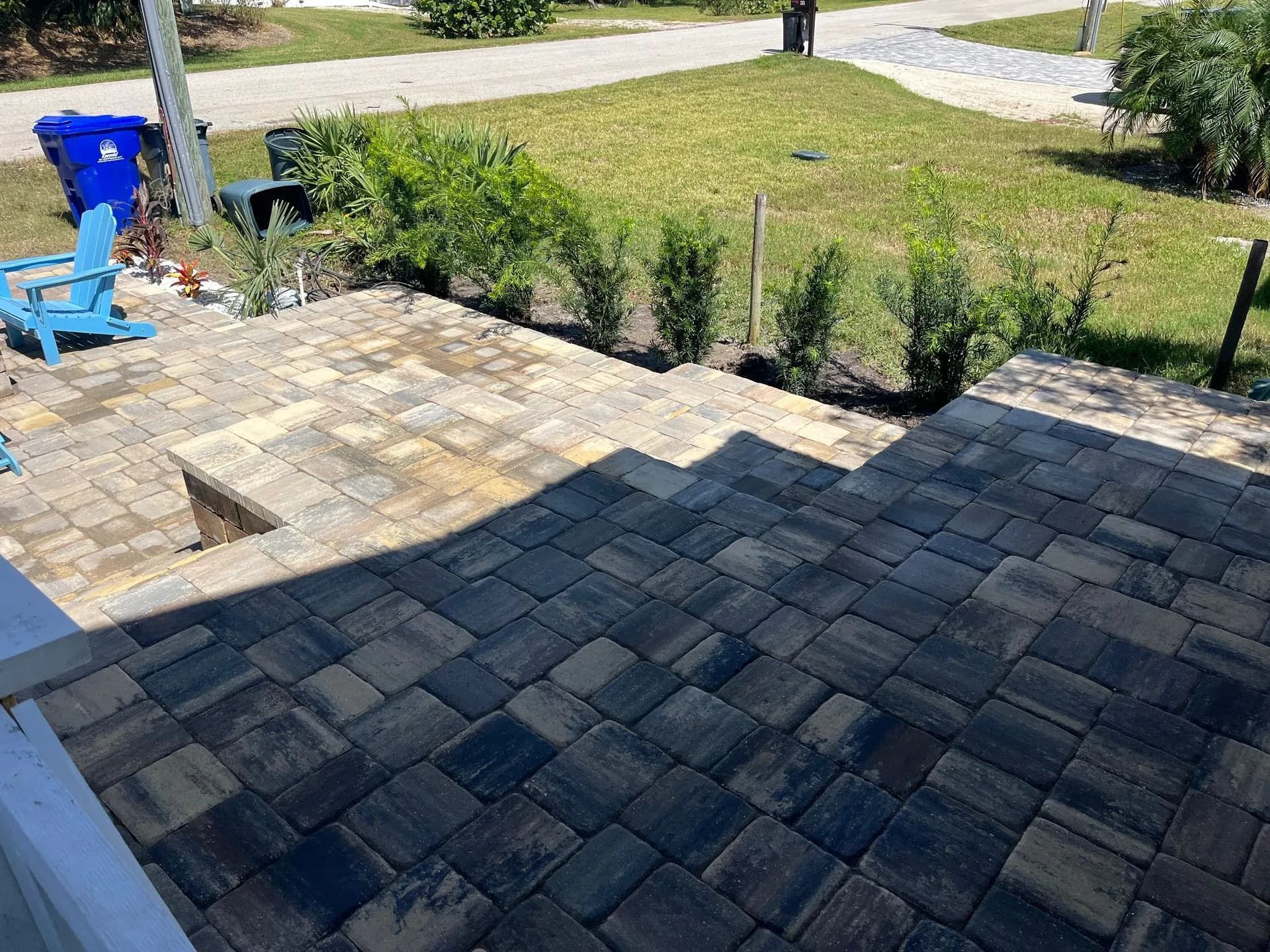 Dark and light-toned paver driveway installation in progress, installed by St. Johns Pavers in Fruit Cove, FL.