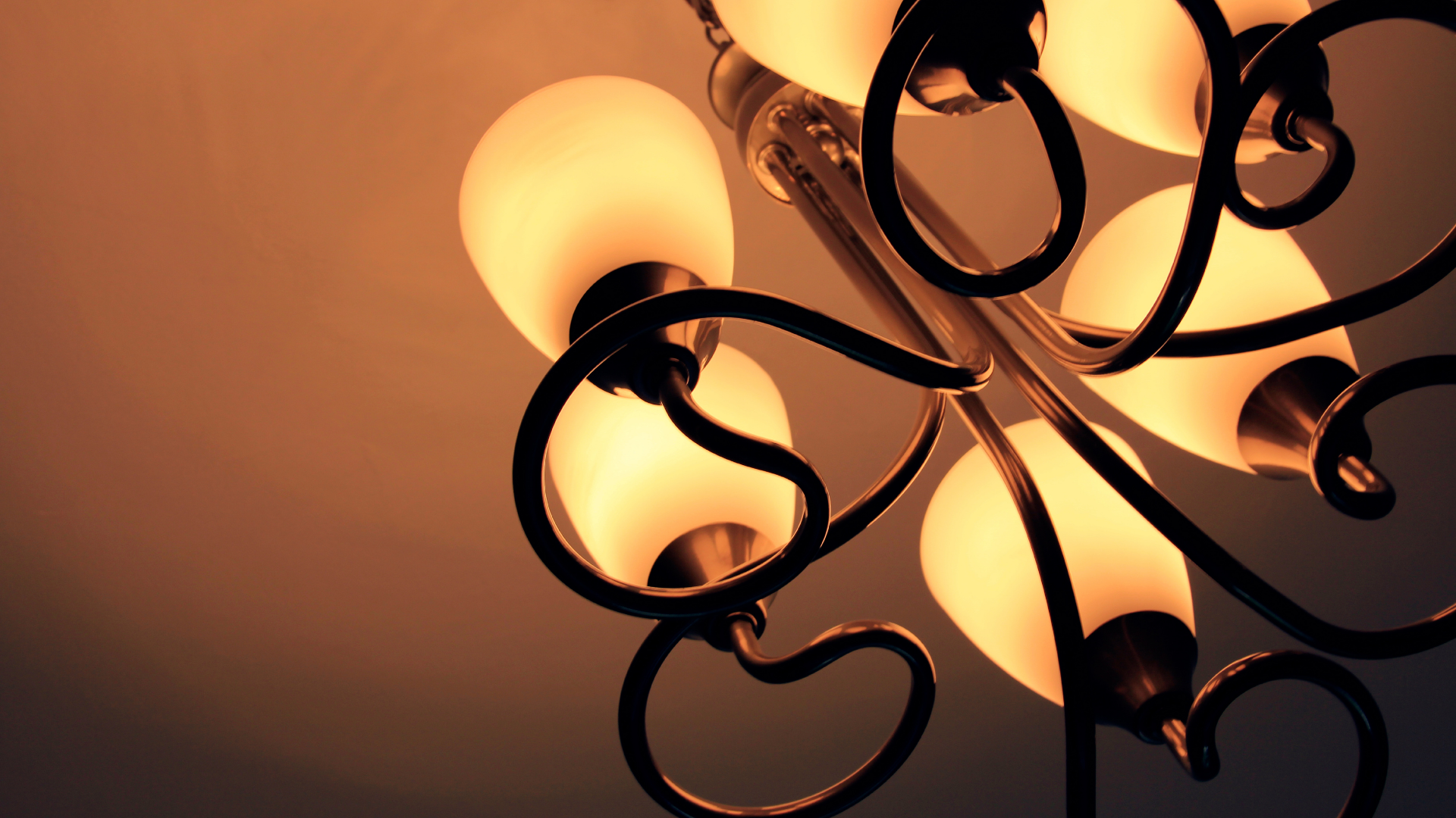 A chandelier with a lot of lights hanging from it