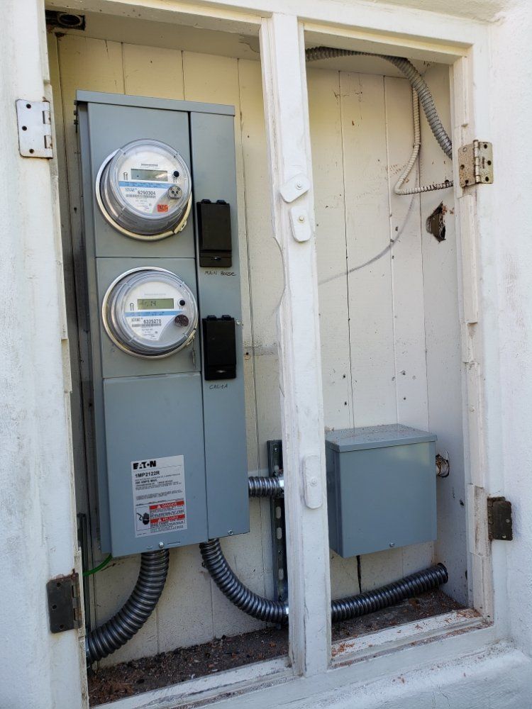 An electrical box with two meters inside of it