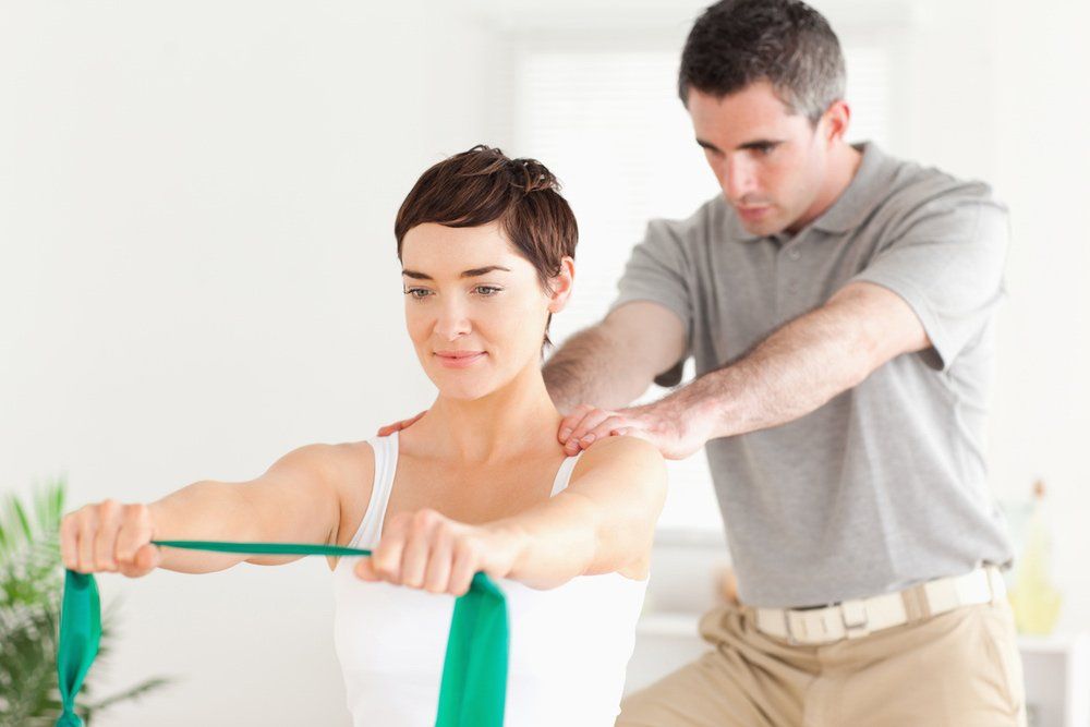 Patient Doing Some Exercises Under Supervision in a Clinic — PhysioCare Townsville In Thuringowa Central, QLD