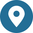 White location pin icon on a blue circle.
