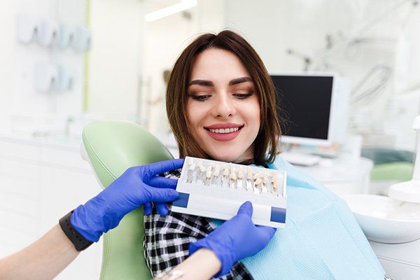 Dentist and His Patient Choose a Tone of Veneers — Eastpointe, MI — Eastland & Professional Dental Center