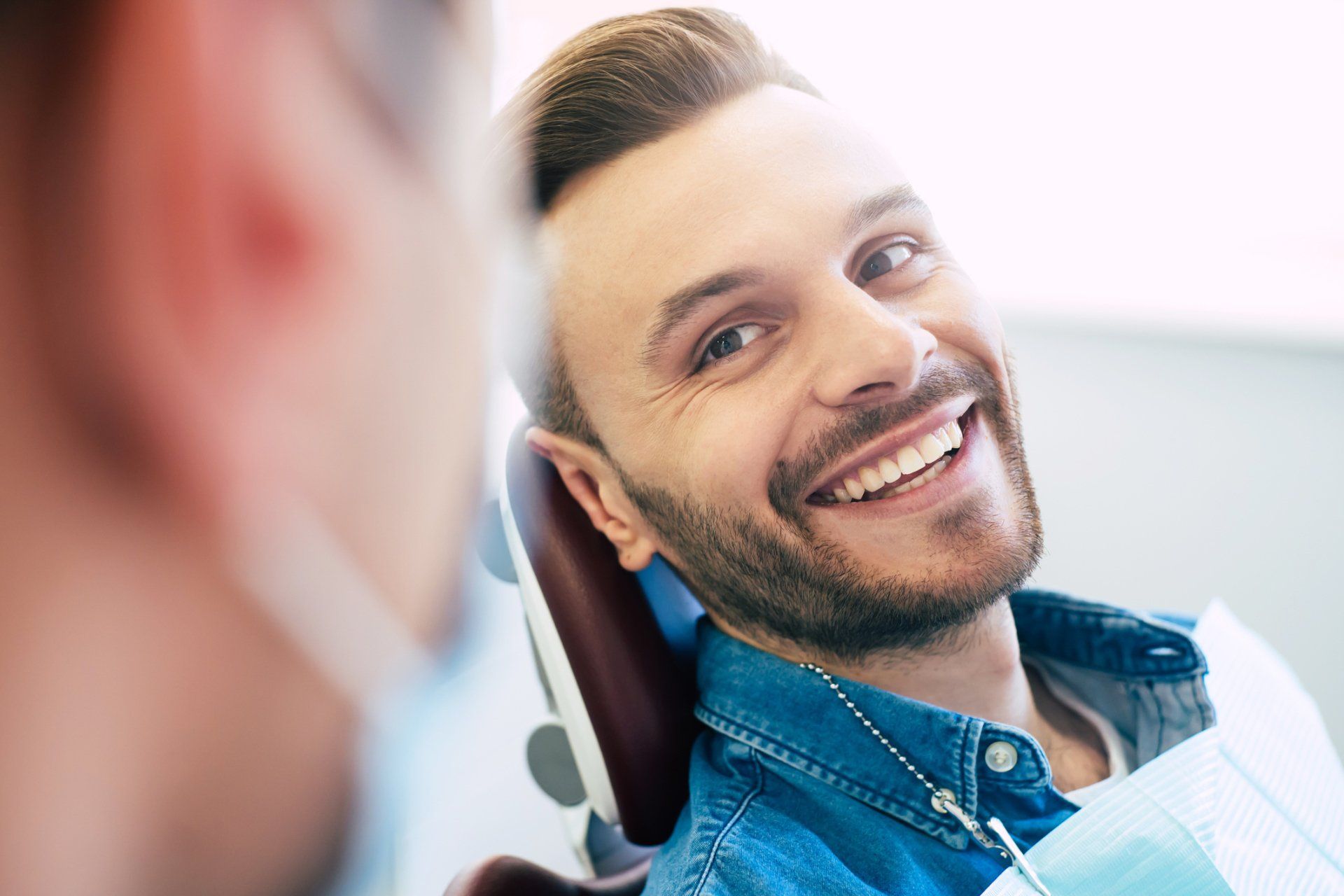 Man Smiling at the Dentist — Eastpointe, MI — Eastland & Professional Dental Center