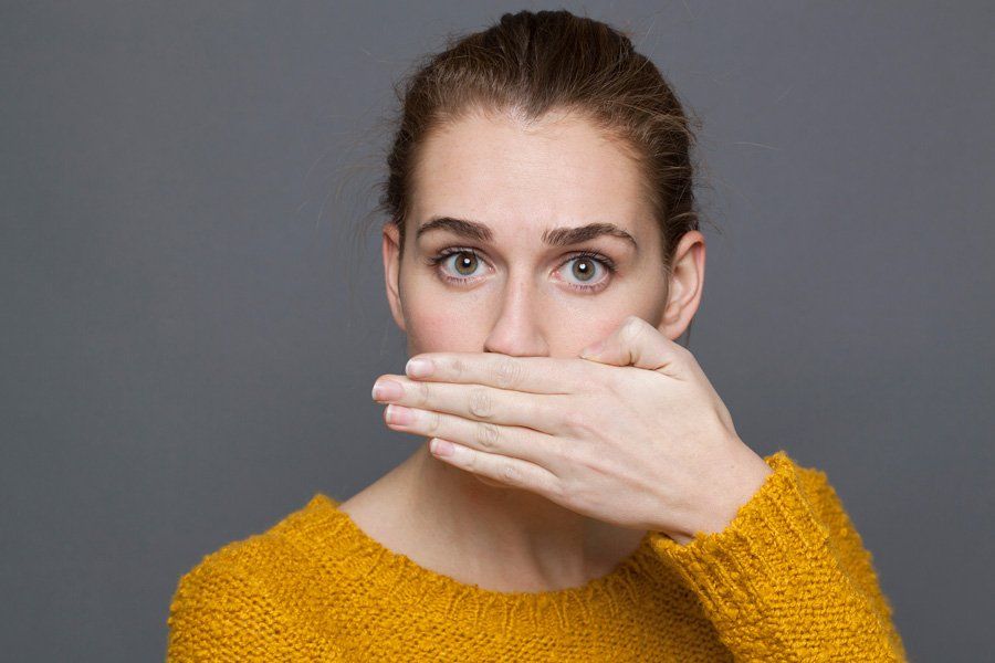 Woman Having Bad Breath — Eastpointe, MI — Eastland & Professional Dental Center
