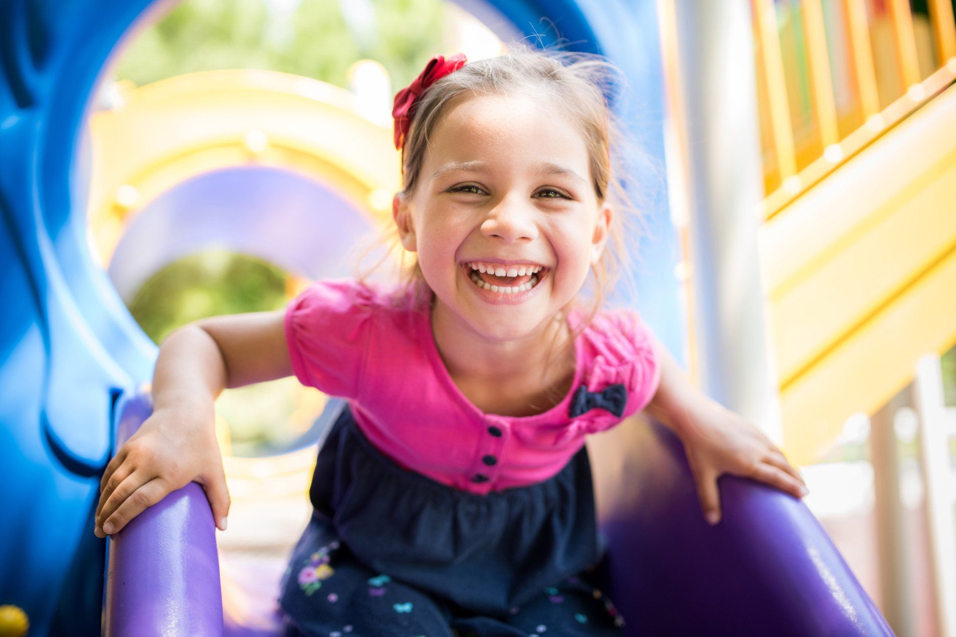 Girl Playing on Playground — Eastpointe, MI — Eastland & Professional Dental Center