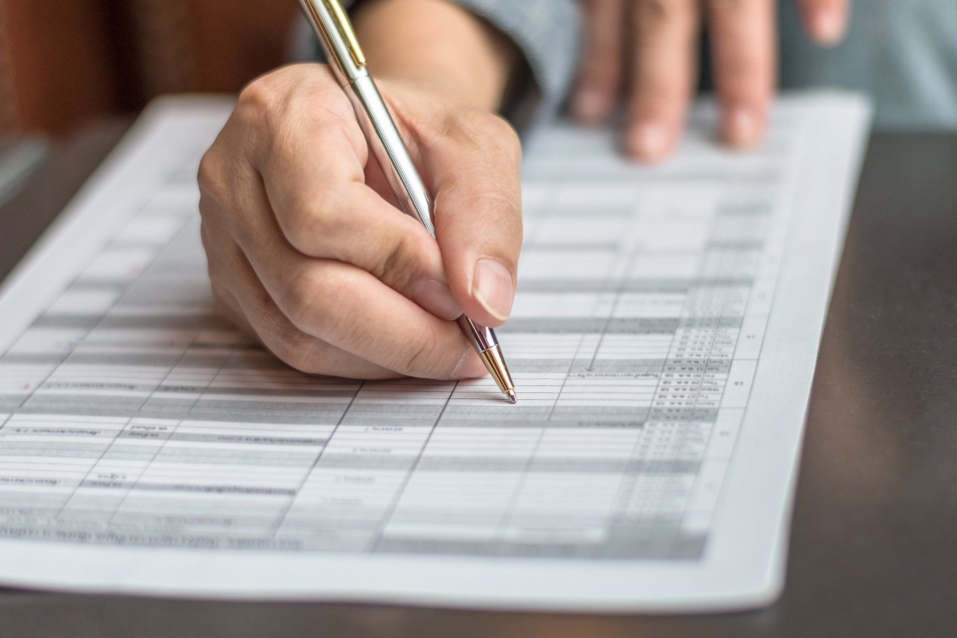 Woman Filling Form — Eastpointe, MI — Eastland & Professional Dental Center