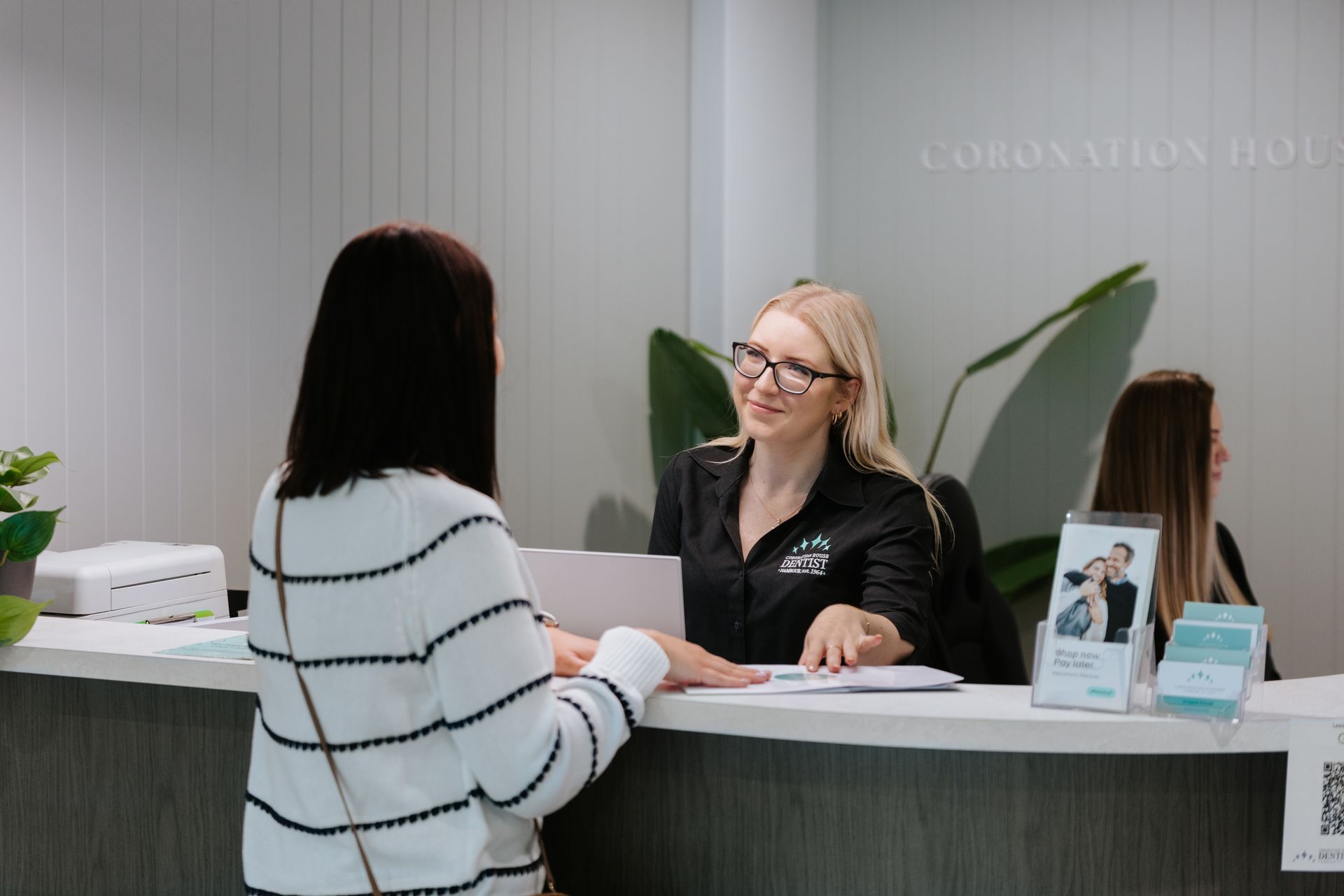 A Man is Getting His Teeth Examined by a Dentist — Coronation House Dentist in Nambour, QLD