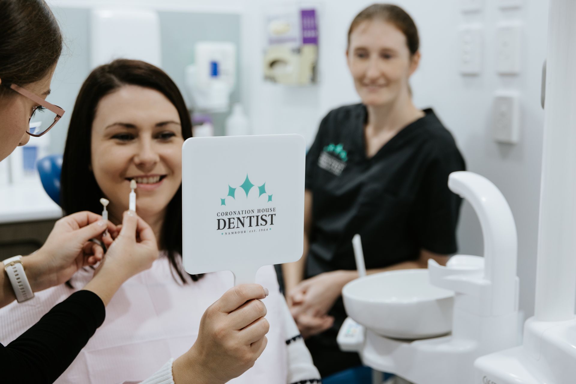 A Group of Dentists Are Working on a Patient in a Dental Office — Coronation House Dentist in Nambour, QLD