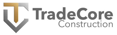 Logo for TradeCore Construction featuring a shield shape with a stylized 