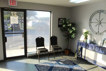 A blue and white compass on a white background