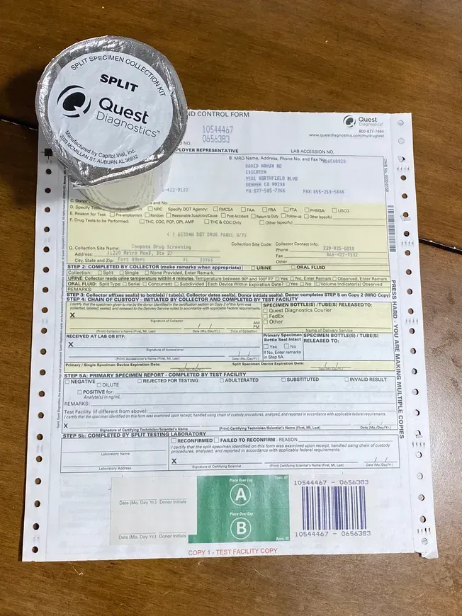 A cup of split quest coffee sits on top of a piece of paper