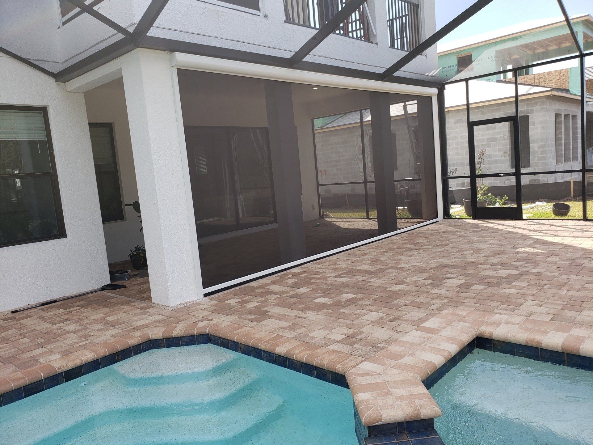A patio area enclosed by a motorized retractable screen system. A patio area enclosed by a motorized retractable screen system.