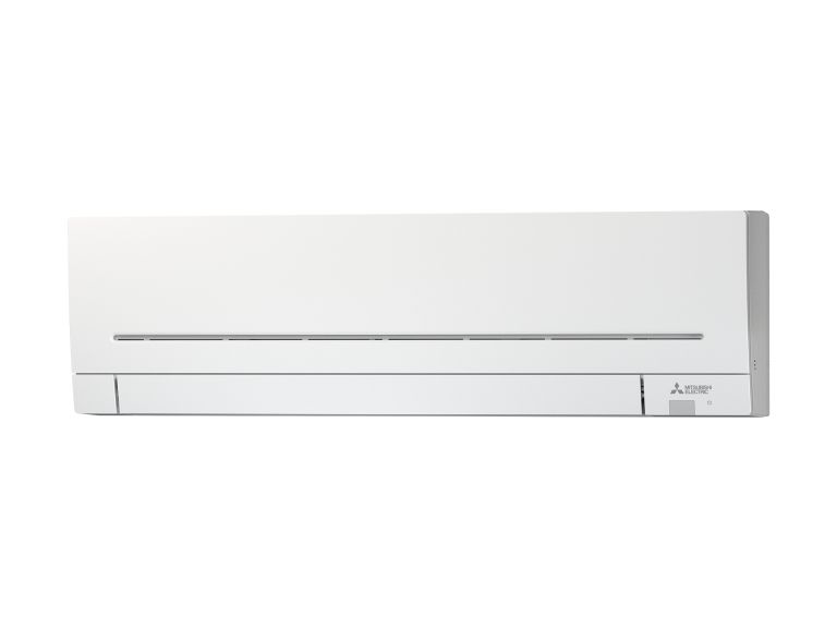 A white air conditioner is sitting on a white surface.