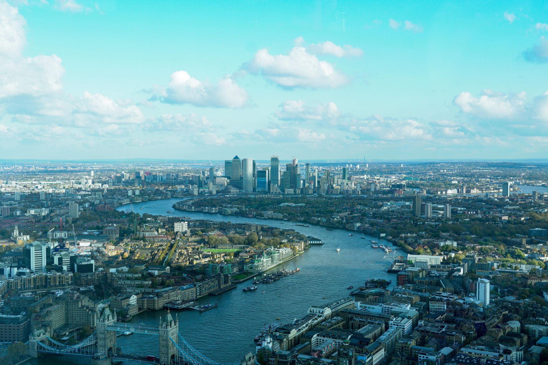 An aerial view of a city with a river running through it.