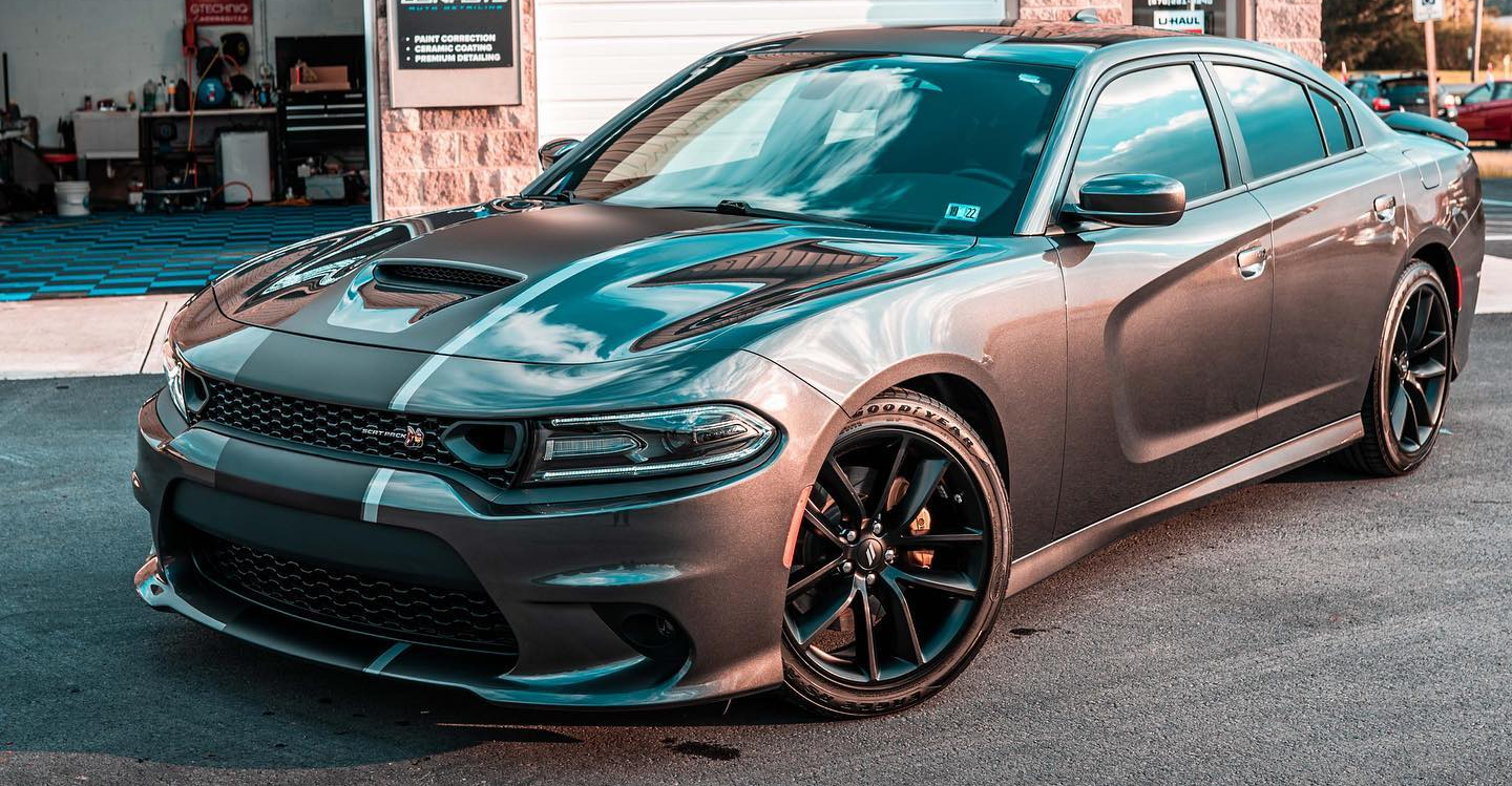 Ceramic Coating - A gray dodge charger is parked in a parking lot.