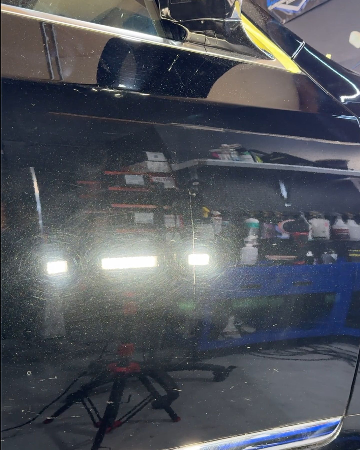 A close up of a car door with a lot of scratches on it